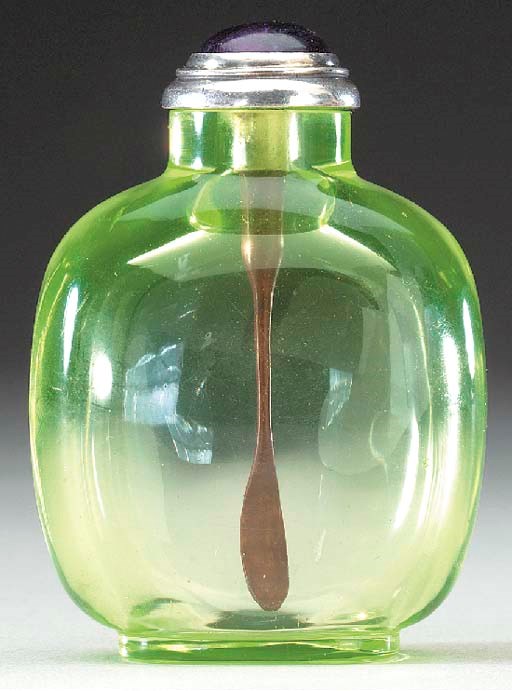 A PALE GREEN GLASS BOTTLE