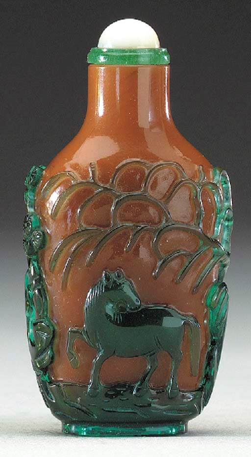 AN UNUSUAL GREEN OVERLAY BROWN GLASS BOTTLE