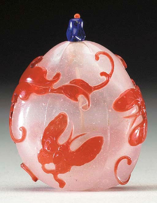 AN UNUSUAL RED OVERLAY GLASS BOTTLE