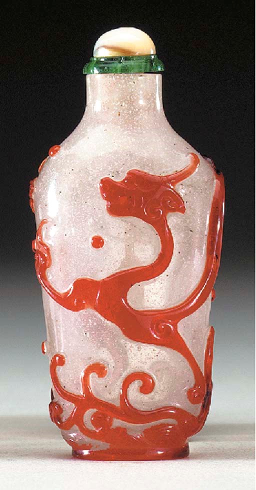 A FINE RED OVERLAY 'SNOWSTORM' GLASS BOTTLE