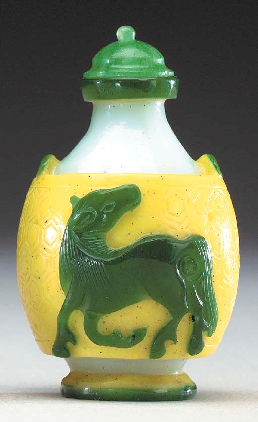 A RARE GREEN AND YELLOW OVERLAY WHITE GLASS BOTTLE