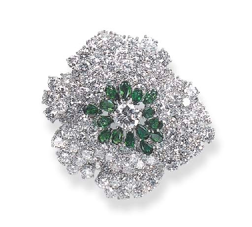 A DIAMOND AND EMERALD BROOCH