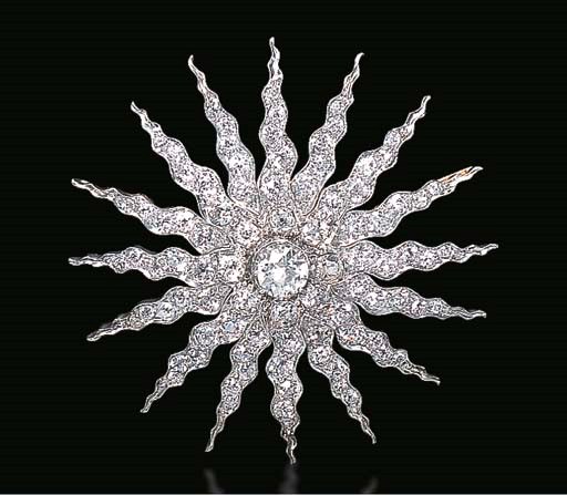 AN ANTIQUE DIAMOND SUNBURST BROOCH, BY THEODORE B. STARR