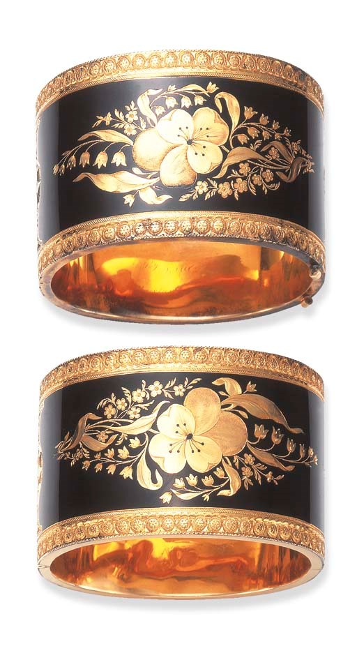 AN UNUSUAL PAIR OF ANTIQUE GOLD AND ENAMEL CUFF BRACELETS