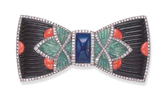 A RARE ART DECO HARDSTONE AND DIAMOND DEVANT DE CORSAGE, BY BOUCHERON