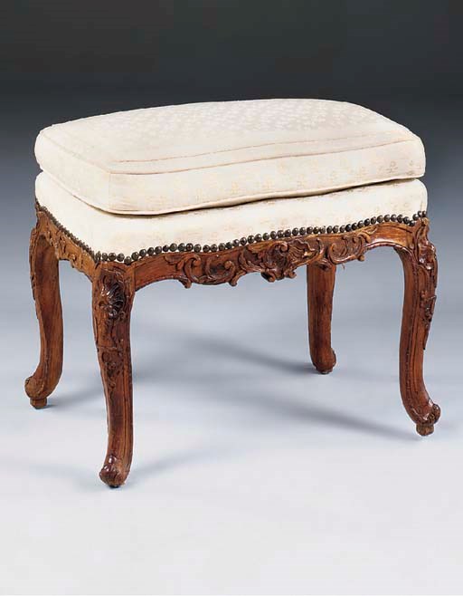 A LOUIS XV CARVED WALNUT STOOL