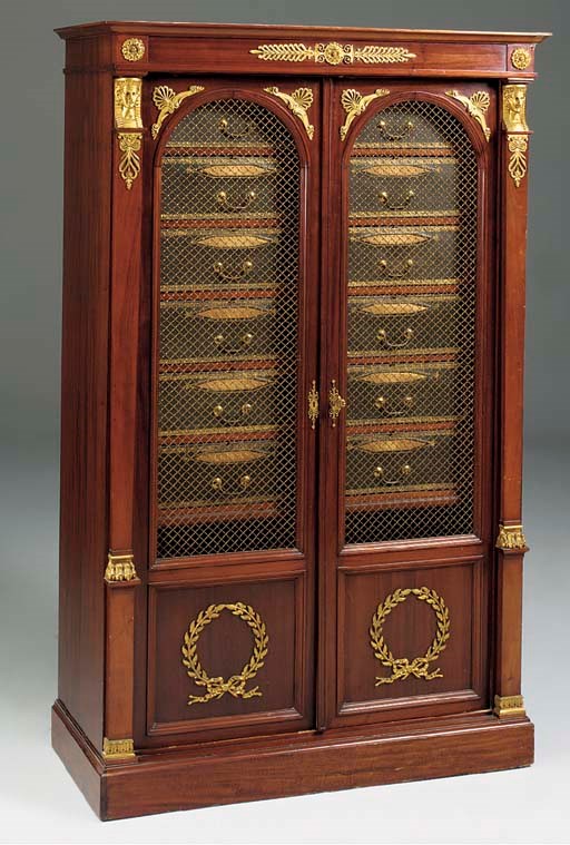 A FRENCH MAHOGANY AND ORMOLU MOUNTED CARTONNIER AND BIBLIOTHEQUE, LATE 19TH CENTURY, in the Empire style