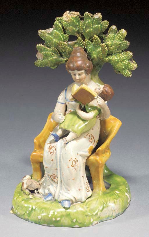 A pearlware group of a Mother and Child