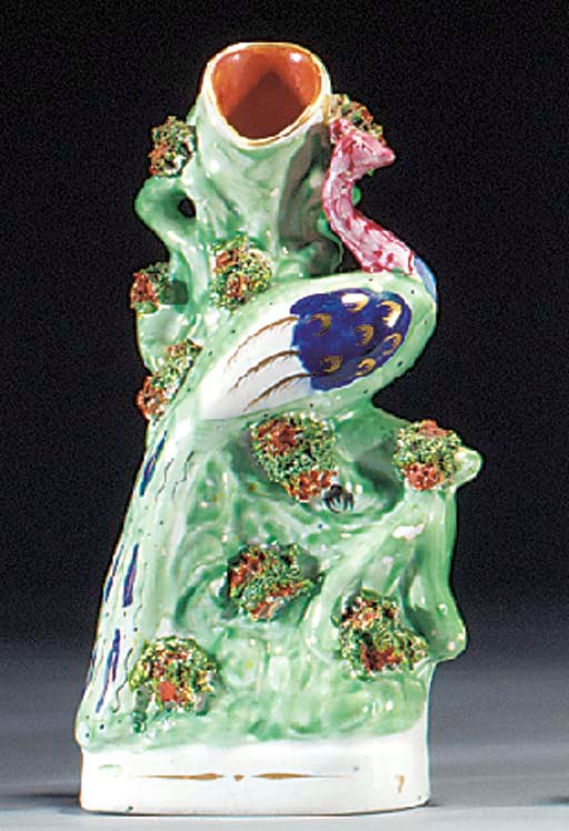 A pair of peacock spill vases