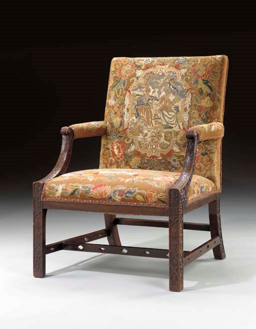 A GEORGE III PROVINCIAL MAHOGANY LIBRARY ARMCHAIR