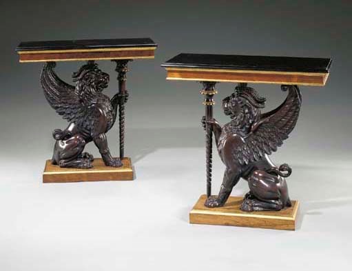 A PAIR OF WILLIAM IV PARCEL-GILT ROSEWOOD AND EBONISED CONSOLE TABLES