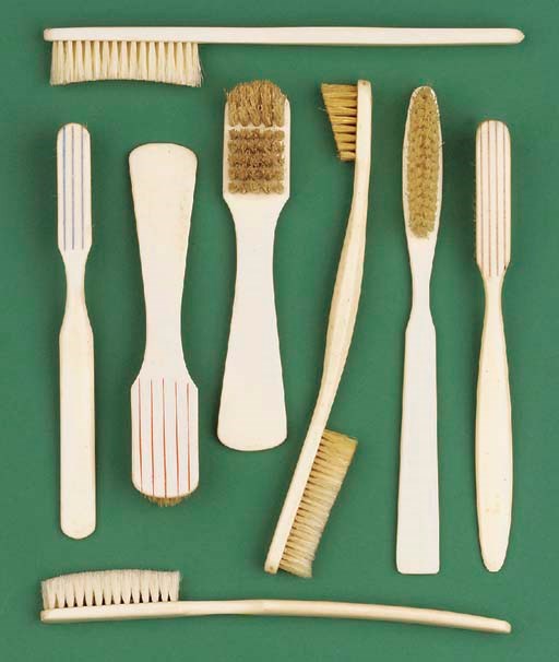 Eight early 19th-Century ivory tooth-brushes,