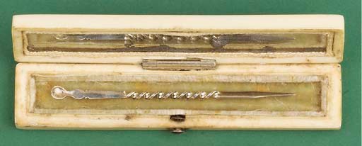 An early 19th-Century ivory toothpick case with silver pattern and mounted inset section of [?]wood,