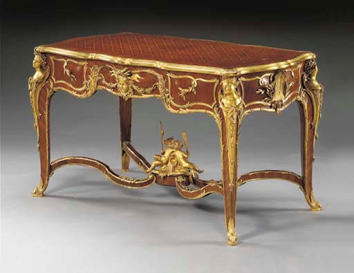 A fine Louis XV style ormolu-mounted tulipwood, mahogany and parquetry centre table