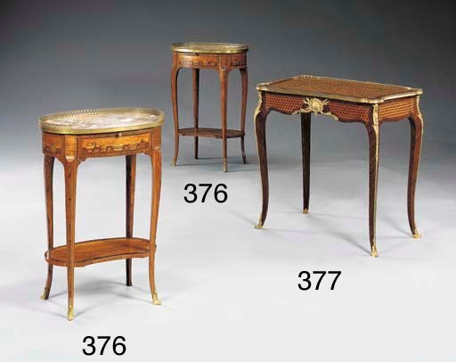 A pair of Transitional style ormolu-mounted tulipwood, satinwood, kingwood and marquetry tables a ecrire