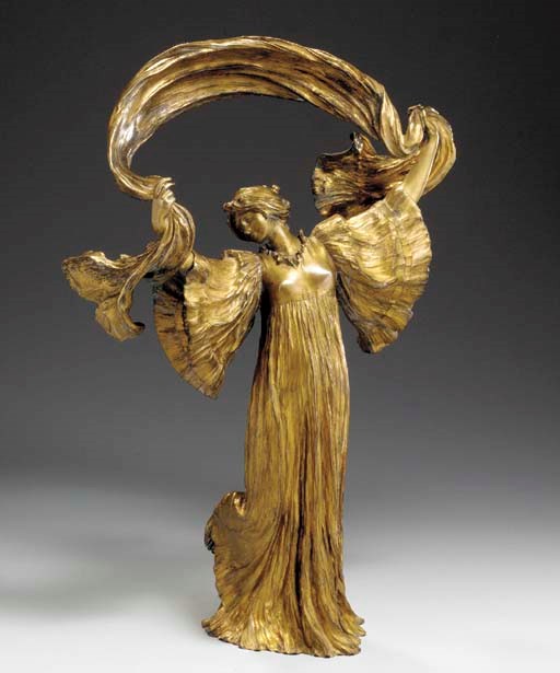 A GILT-BRONZE SCULPTURE
