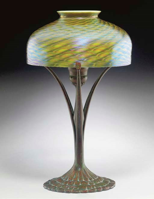 A FAVRILE GLASS AND BRONZE DESK LAMP