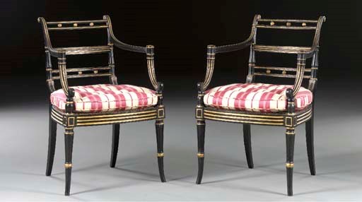 A PAIR OF REGENCY PARCEL-GILT AND EBONIZED ARMCHAIRS,