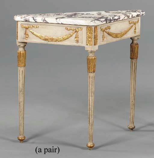 A PAIR OF ITALIAN NEOCLASSIC-STYLE WHITE-PAINTED AND PARCEL-GILT CORNER TABLES,