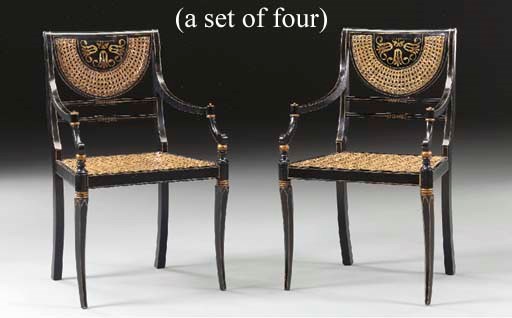 A SET OF FOUR REGENCY STYLE PARCEL-GILT AND EBONIZED ARMCHAIRS,