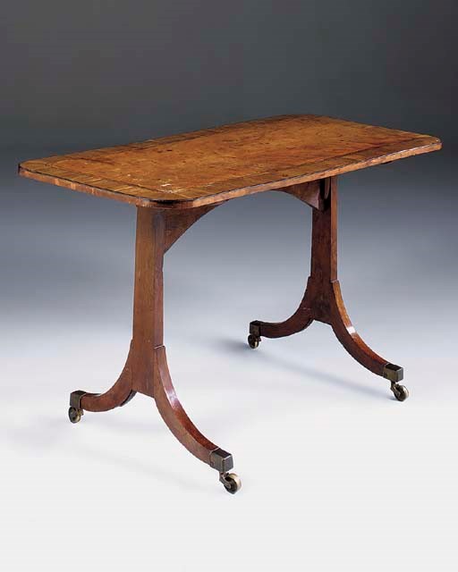 A REGENCY YEWWOOD MAHOGANY CROSSBANDED AND INLAID WRITING TABLE