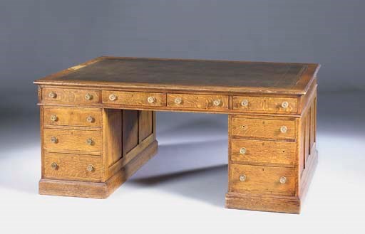 An oak partners desk, first half of the 20th century