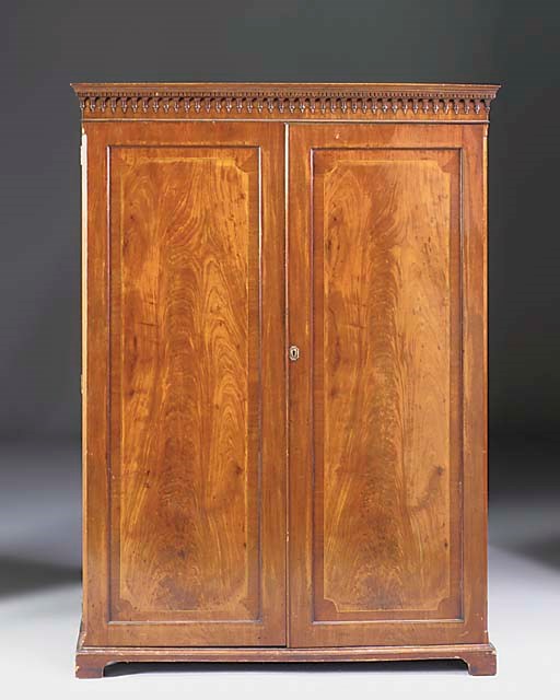 An Edwardian mahogany and line inlaid wardrobe