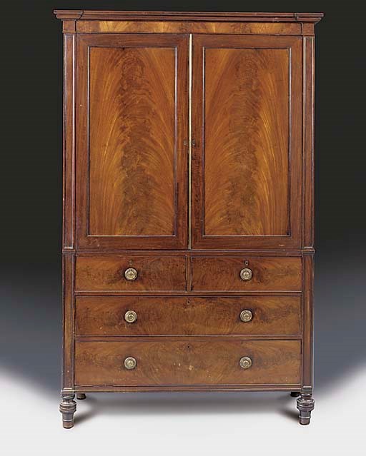 A late Regency mahogany linen press