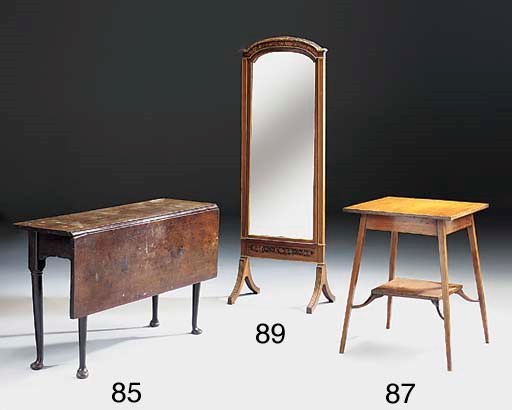 An Edwardian mahogany and parcel gilt cheval mirror