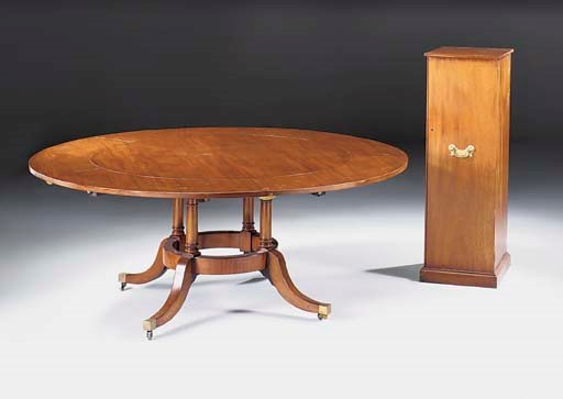 A circular mahogany radially extending dining table, late 20th century