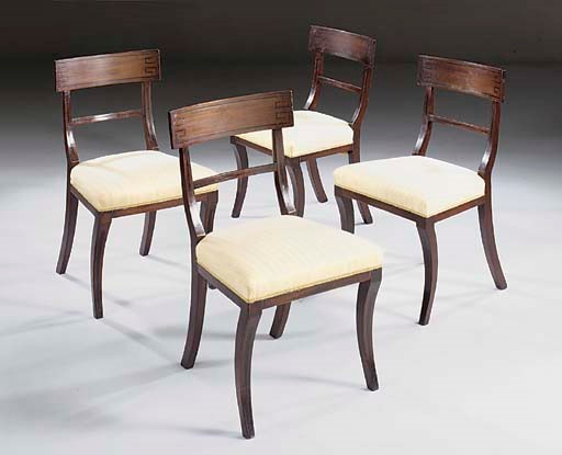 A set of four Regency mahogany and line inlaid dining chairs