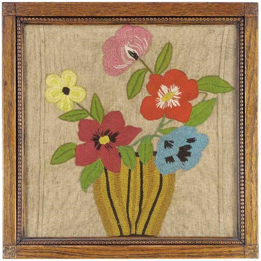 A naive woolwork picture of a vase of flowers, early 20th century