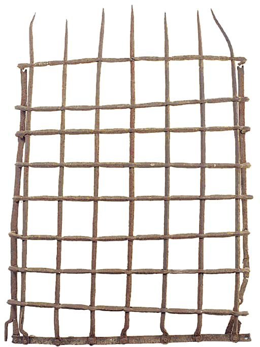A wrought iron lattice window grill, possibly 17th century