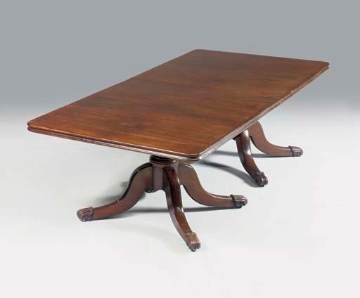 AN IRISH REGENCY MAHOGANY TWIN-PEDESTAL DINING-TABLE
