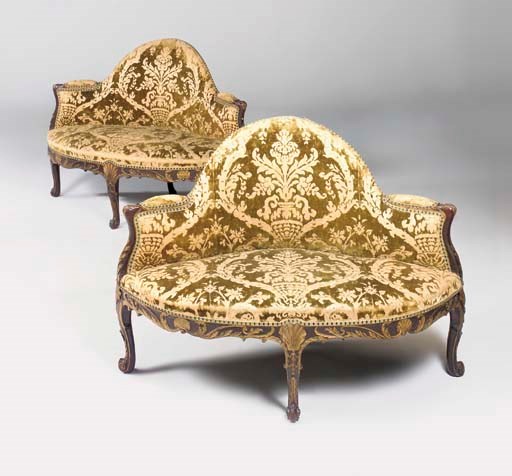 A PAIR OF GEORGE II MAHOGANY AND PARCEL-GILT CORNER SOFAS