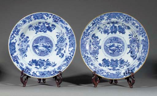 A pair of blue and white circular plates
Kangxi