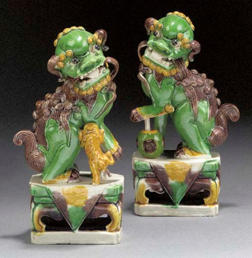 A pair of famille verte biscuit models of Buddhistic lions
Kangxi