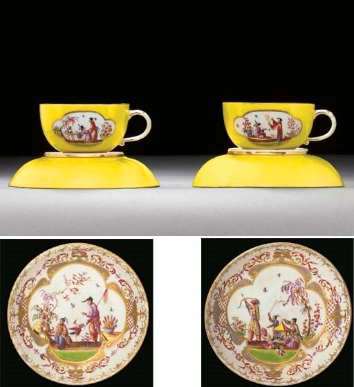 A pair of Meissen yellow-ground chinoiserie teacups and saucers