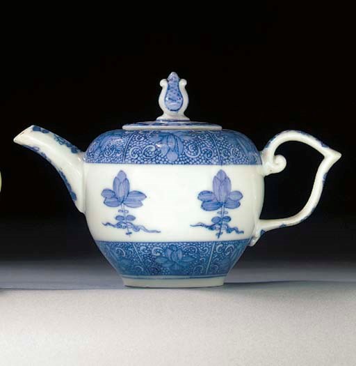 A Meissen blue and white bullet-shaped teapot and a cover