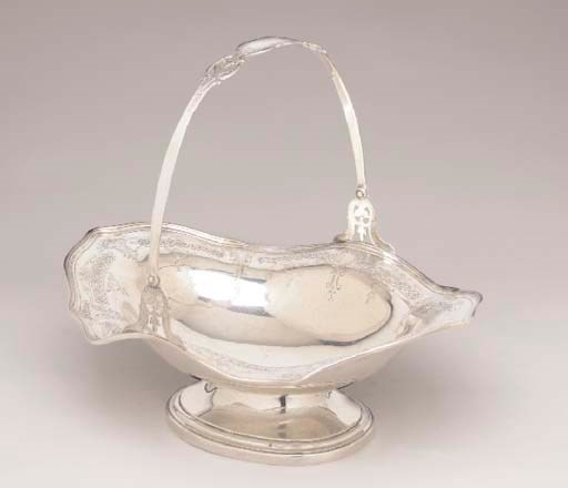 AN AMERICAN SILVER CAKE BASKET,