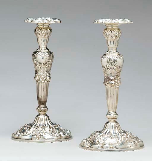 A SET OF FOUR SILVER CANDLESTICKS,