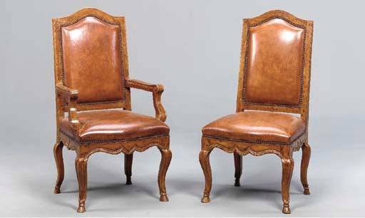 A SET OF TWELVE REGENCE STYLE WALNUT DINING CHAIRS,