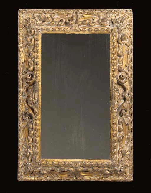 AN ITALIAN BAROQUE GILTWOOD MIRROR,