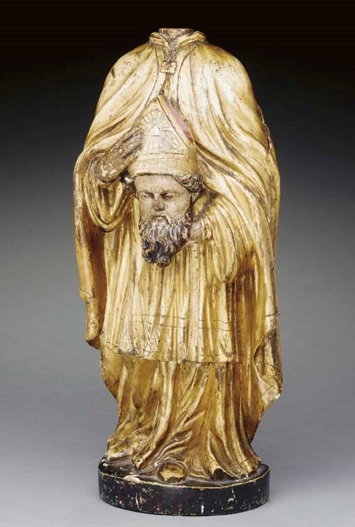 A FRENCH POLYCHROME-DECORATED AND PARCEL-GILT FIGURE OF ST. DENIS,