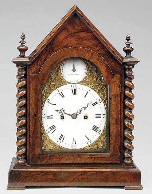 A George III bracket clock movement in later walnut case