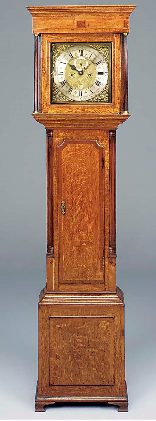 An English oak and mahogany cross-banded longcase clock