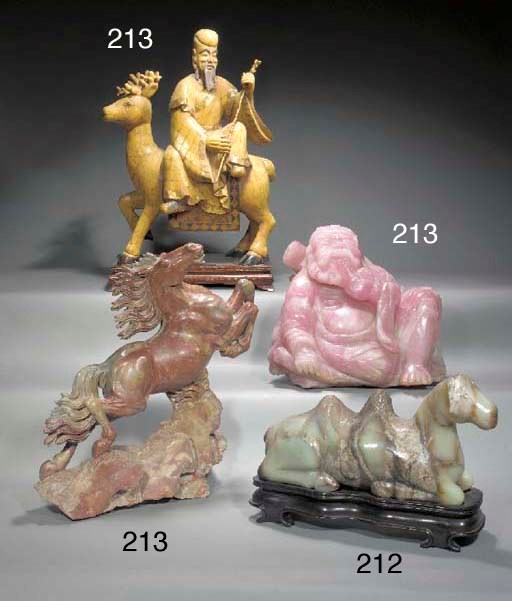A CHINESE MOTTLED PALE JADE MODEL OF A RECUMBENT CAMEL
20TH CENTURY