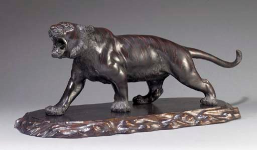 A JAPANESE PATINATED BRONZE MODEL OF A TIGER
RAISED RECTANGULAR SEALMARK TO UNDERSIDE, MEIJI PERIOD
