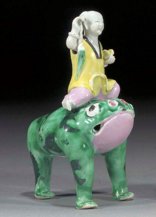 A FAMILLE ROSE GROUP OF A BOY ON A MYTHICAL THREE-LEGGED TOAD
QIANLONG