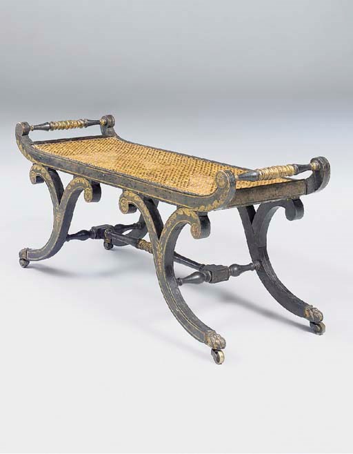 A REGENCY BLACK AND GILT-JAPANNED CANED WINDOW SEAT
